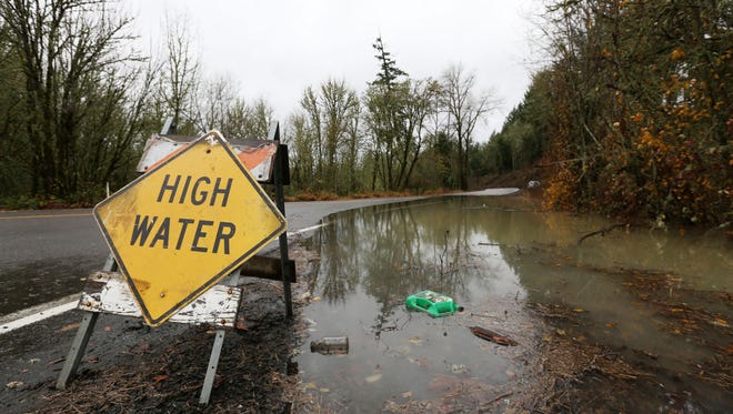 High water along Old Fort Road south of Monmouth on Tuesday, Dec. 8, 2015.