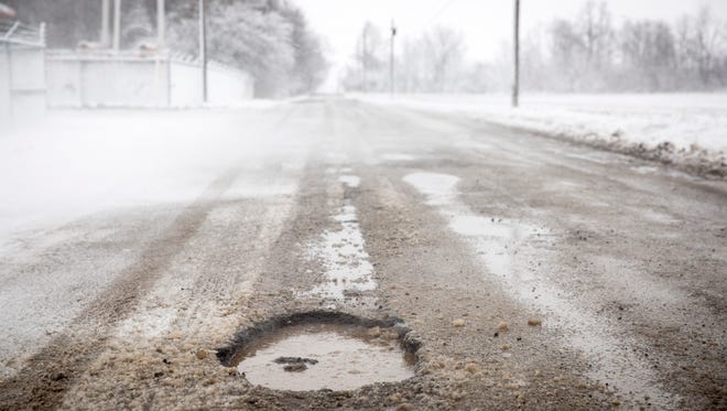 With cold freezing weather returning, potholes have begun to surface as rain freezes with dropping temperatures.