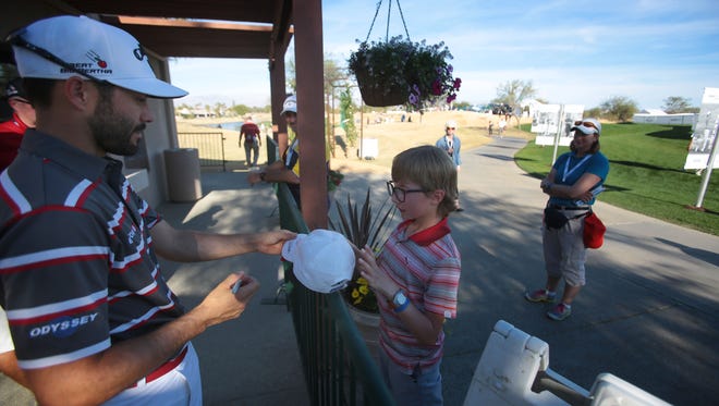 Liam Hartling, 9, get an autograph from Canadian golfer Adam Hadwin at PGA West in La Quinta on Thursday, January 21, 2016 during the 1st round of the 2016 CareerBuilder Challenge.