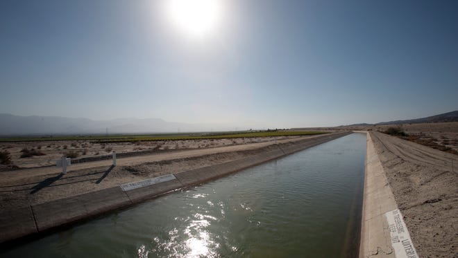 In this 2014 photo, the Coachella branch of the All-American Canal passes through the desert in Mecca, California.