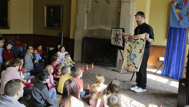 Daniel Lusk, an Indianapolis-based magician, performs for children Sunday during Family Fun Day at Purdue University.