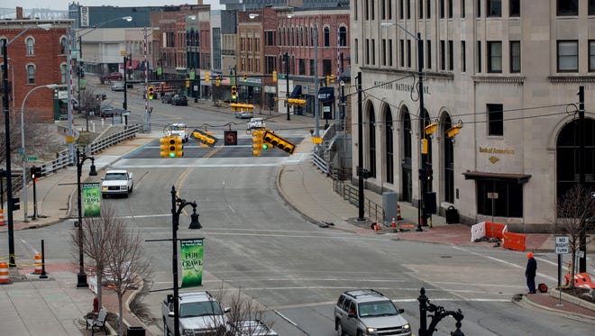 Vehicles pass through the intersection of Military and Water streets Wednesday, March 23, 2016 in downtown Port Huron. Work on the intersection is expected to be completed in early to mid-May.