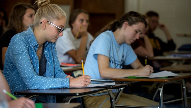 Rachel McClelland, 17, takes notes during a global studies class Thursday, September 15, 2016 at Port Huron Northern High School. McClelland has been named a National Merit semifinalist.