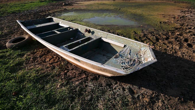 An abandoned boat sits in the remains of a dried out pond Oct. 26 in Dawson, Ala. Because of the drought, the U.S. Small Business Administration has made Federal Economic Injury Disaster Loans available to many small businesses in Tennessee.