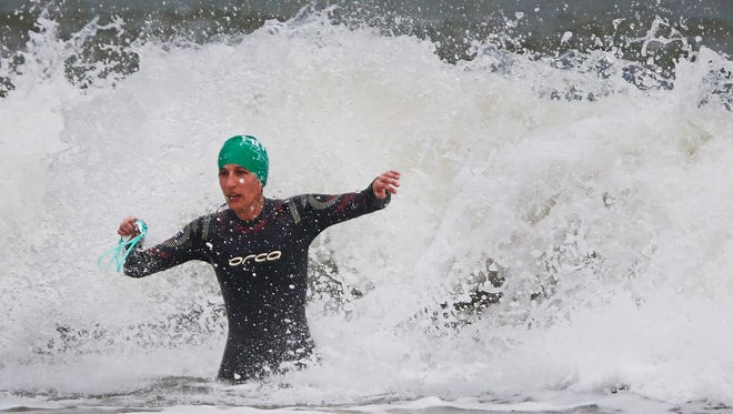 Margaret Niekrash fights swells coming out of the Gulf of Mexico Sunday, Jan, 10, 2016 at Vanderbilt Beach in Naples, Fla. Today marked the second day of the HITS Triathlon Series with the open, sprint and olympic categories. (Corey Perrine/Staff)
