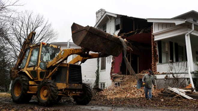 Demolition is underway at a home in the Upper Highlands on Tremont Drive. Owners of the home opted to demolish the home after determining that renovations would be too costly and complicated.