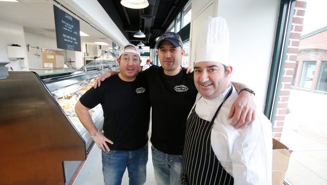 The Nevins brothers, Doug, Dave and Jeremy, who along with their father Bruce, not pictured, are co-owners of Siegel Bros. Marketplace in Mount Kisco.