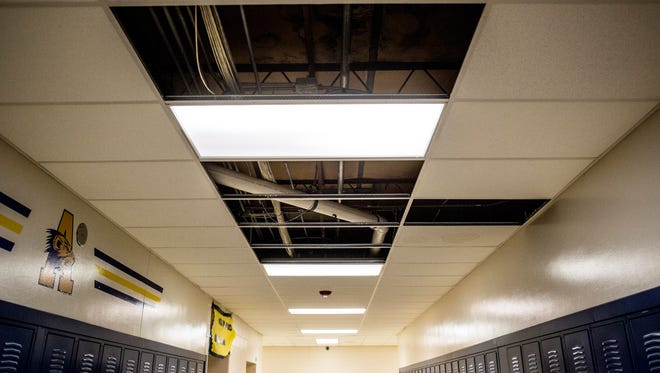 The ceiling is damaged from water leaks in a hallway at Algonac High School.