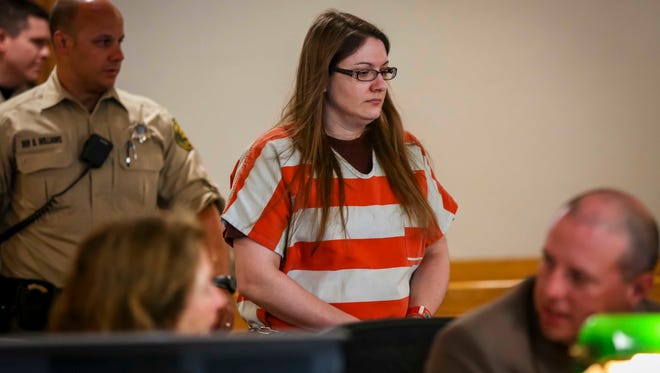 Nicole Finn enters a Polk County Courthouse courtroom Wednesday, May 31, 2017, in Des Moines. Nicole Finn asked a judge to give her a separate trial from her ex-husband, Joseph Finn II, who faces kidnapping and other charges in his daughter's death. The parents were currently scheduled to stand trial together in Des Moines in October.