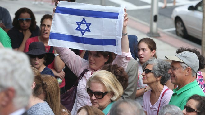 People gather on the front steps of White Plains City Hall to hear speakers talk about their support of Israel during a July 2014 Support Israel rally.