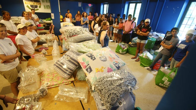 Students thank the event organizers after picking out supplies for their dorm rooms courtesy of Grab Bag, an organization that collects lightly used and new dorm supplies. The event was held at Sarah Lawrence College in Bronxville July 21, 2017.