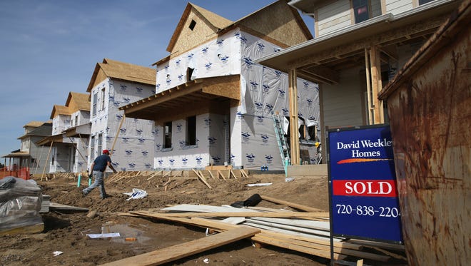 A construction worker on a housing site on May 3, 2013 in Denver, Colorado. Seven of Redfin's 30 Most Competitive Neighborhoods of 2016 were in the Denver area.
