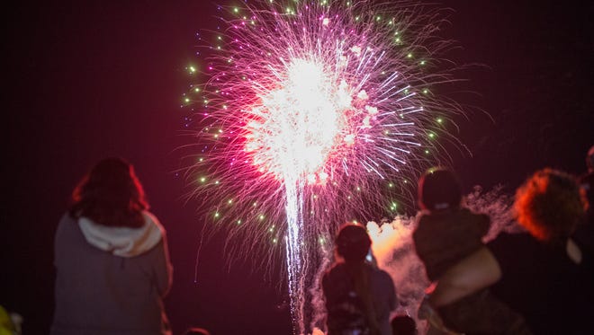 People watch fireworks at Fiesta de la Flor on Saturday, April 14, 2018 at the American Bank Center. 