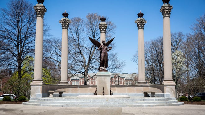 The Beneficence Statue on Ball State's campus is flanked by multiple gardens and budding trees that make up parts of the arboretum which consists of nearly 7,000 trees of 250 different types across campus. Multiple trails bring walkers near placards that identify the different types. 