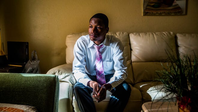 Nehemy Antoine, 19, in his East Naples home on Sunday, June 17, 2018. Antoine came to the United States from Haiti with his father when he was 17 years old. He was denied admission to Golden Gate High School when he tried to enroll because he was told that he was too old to finish in a timely manner. Antoine was directed instead to a minimalist GED program run by the district.
