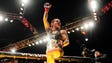 Cris Cyborg celebrates after defeating Holly Holm in