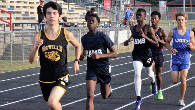 Neville's Josiah Perez won the boys 3,200 meter run (Pictured) and boys 1,600 meter run en route to capturing the District 2-4A Boys Outstanding Track Individual Award at West Ouachita's A.R. "Red" Simms Stadium on Wednesday.