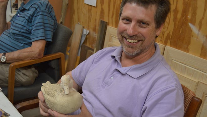 John Wilks, a member of the Central Louisiana Wildfowl Woodcarvers, showcases a "work-in-progress" duck decoy that he is making. He's been working on the piece since January, and hopes to get it completed by the holidays this year. "It takes a long time to get the feathers to look realistic. It's a labor of love," he said.