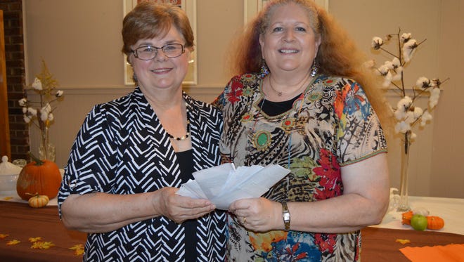 Shirley Ingram (left) and Judy Ginsburgh (right). Ginsburgh presented Ingram with nearly $10,000 dollars donated from members of "100 women who care about Central Louisiana."