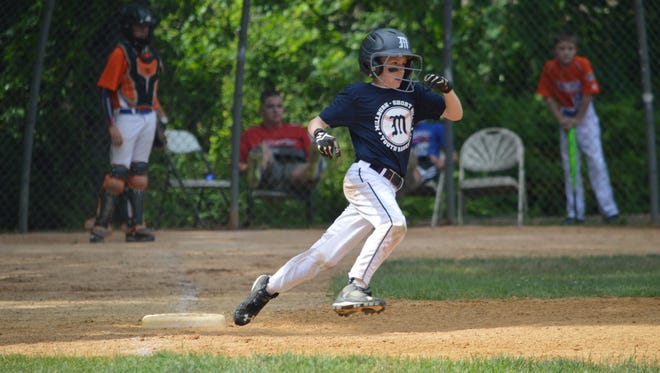 Greg Rosenthal rounds first base during a 4-for-4 game for Millburn 10U.