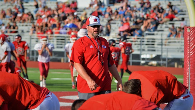 Jim Ned coach Jerod Womack oversees his team warming up prior to a scrimmage with Ballinger on Friday, Aug. 18 in Tuscola.