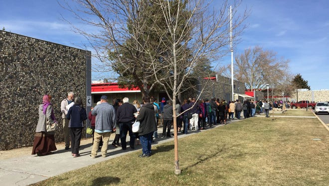 A long line for the Democratic caucus is seen today at Wooster High School.