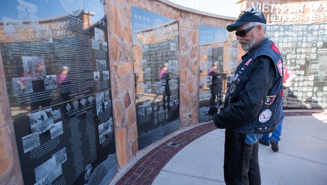 Chad Hegreberg, of Yerba Linda California, one of the many riders making the Run For The Wall looks over the Vietnam War Memorial at Veterans Park during a stop in Las Cruces on Friday May 18, 2018. The Run for the Wall is a 10-day journey starting in California and ending at the Vietnam Memorial in Washington, D.C.