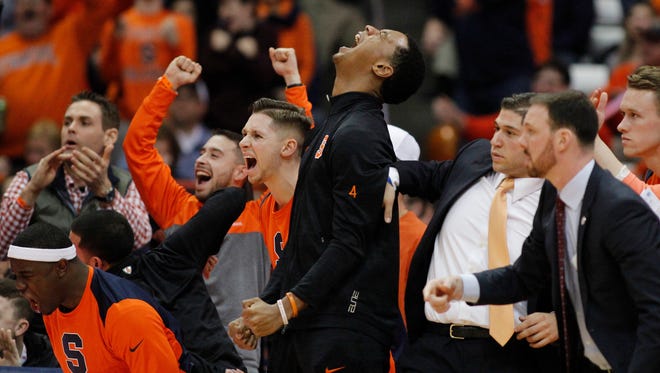 Syracuse players cheer as Syracuse ties the game late in the second half of an NCAA college basketball game against North Carolina in Syracuse, N.Y., Wednesday, Feb. 21, 2018. North Carolina won 78-74. (AP Photo/Nick Lisi)