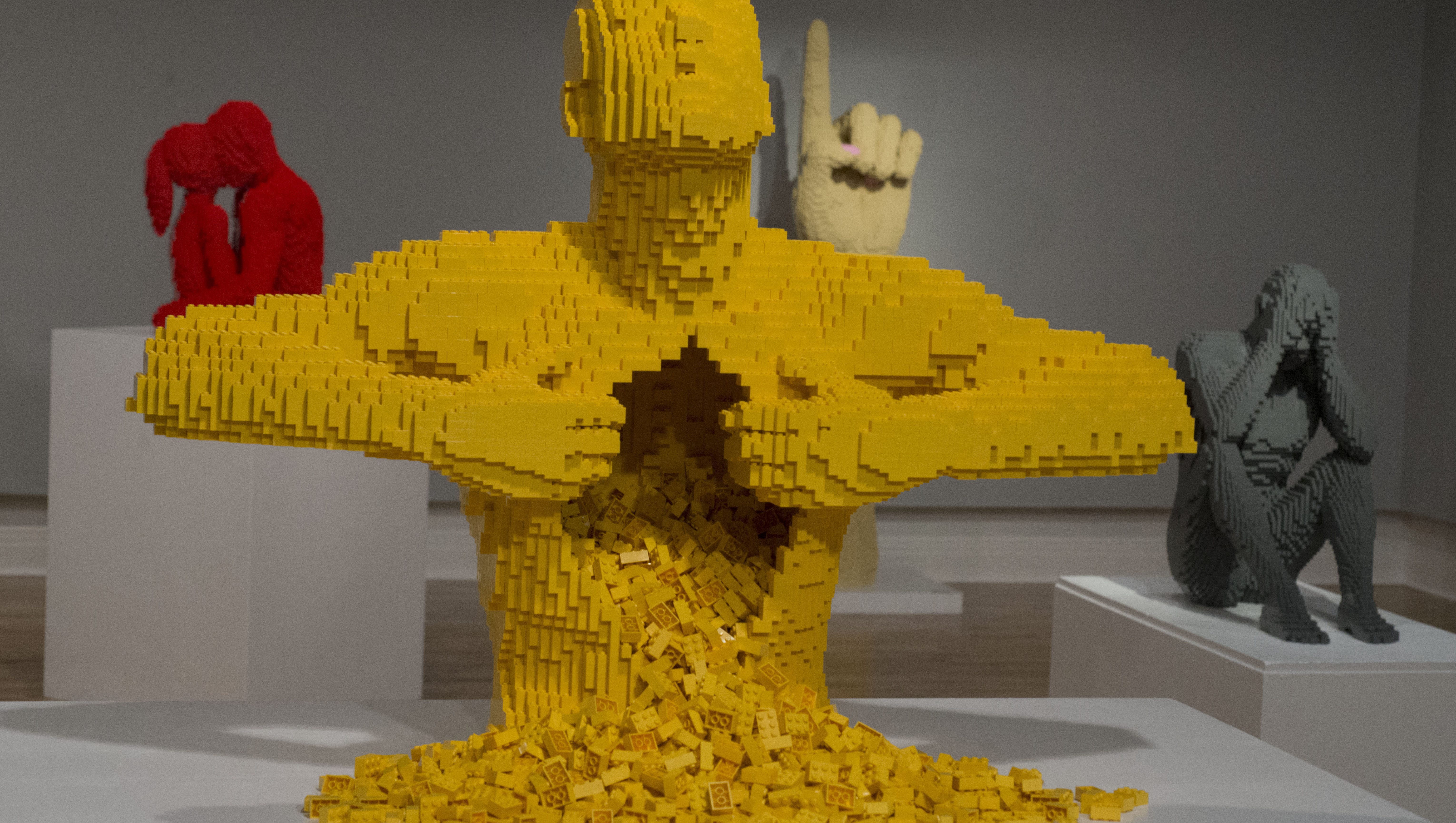 behind giant Lego bricks around town solved