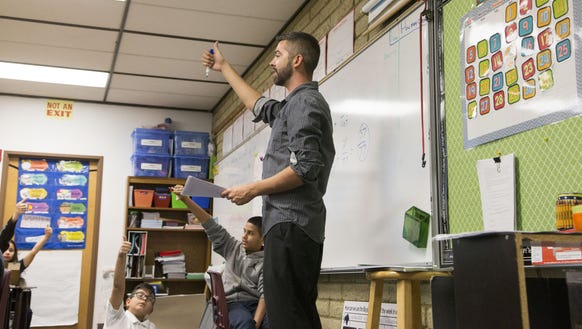 Tyler DeMoe, 27, teaches math to fifth-graders at Palm