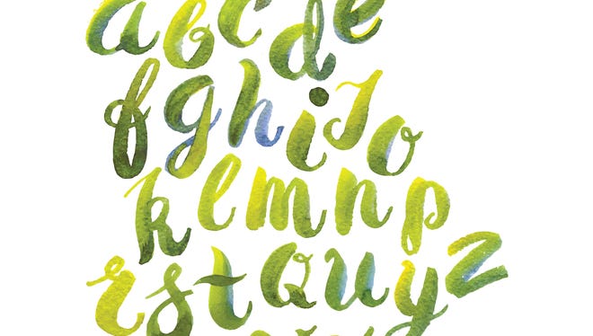 Hand drawn watercolor alphabet made with brush-shades and smears of spring leaves and flowers.