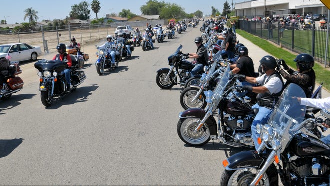 Soft Thunder riders help escort the Vietnam War Memorial wall on Sunday, April 19, 2015.