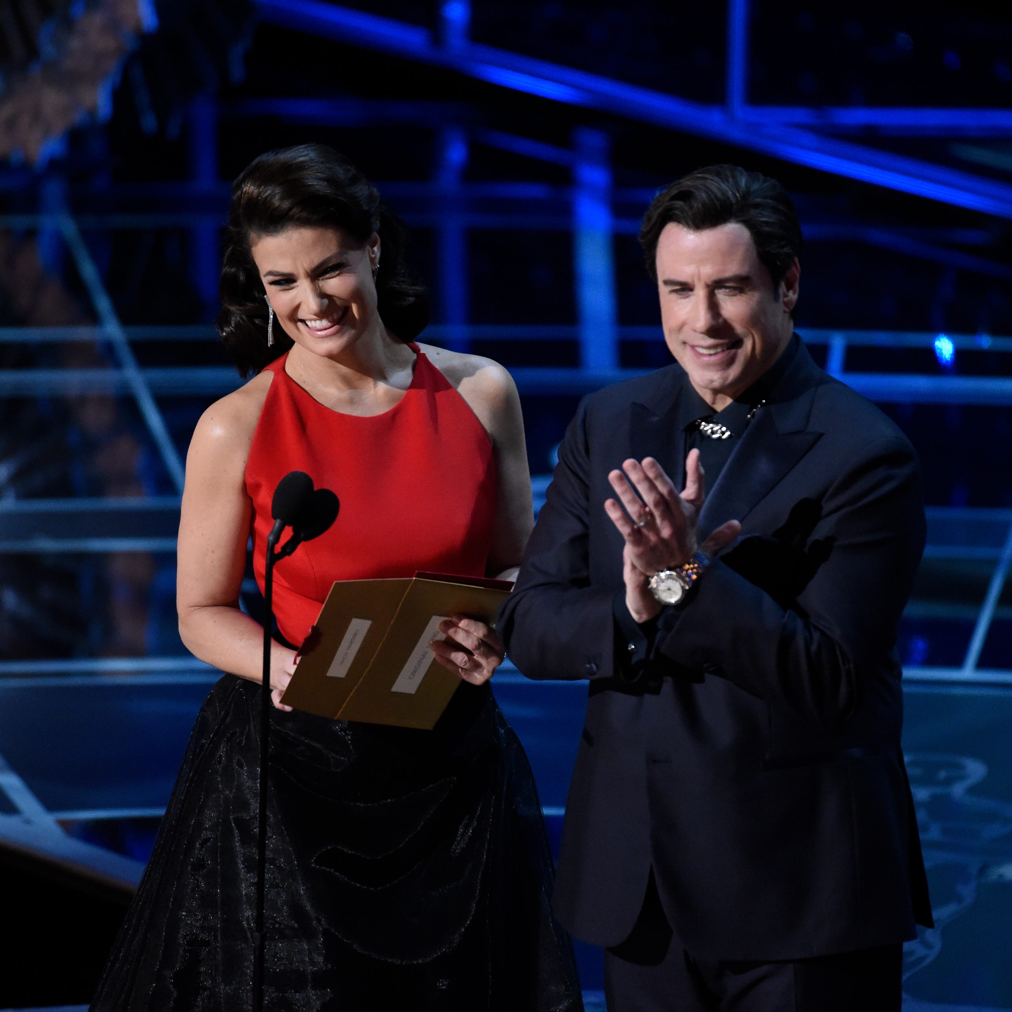 Idina Menzel and John Travolta present the Oscar for best original song, but not until after poking fun at last year's "Adele Dazeem" debacle.