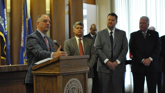 Gov. John Bel Edwards on Tuesday announces he has given the go-ahead to the project to relocate the Central Louisiana Technical Community College's Alexandria campus to downtown Alexandria. From left are Edwards, Alexandria Mayor Jacques Roy, Louisiana Community and Technical College System President Monty Sullivan and Sen. Jay Luneau.