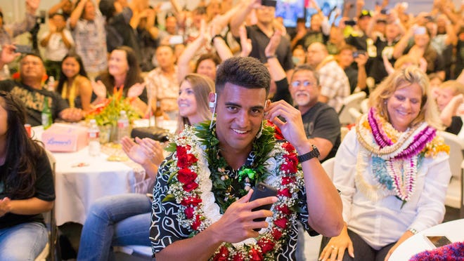 Former Oregon quarterback Marcus Mariota reacts to being drafted by the Tennessee Titans with the second pick in the first round on NFL Draft Day Thursday, April 30, 2015, in Honolulu. (Thomas Boyd/The Oregonian via AP, Pool)