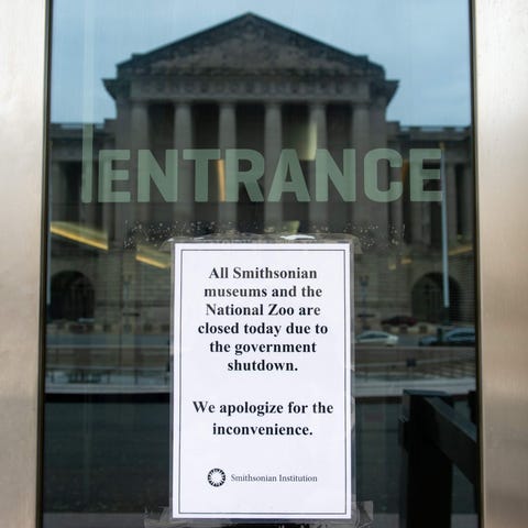 A sign hangs on the door of the Smithsonian...