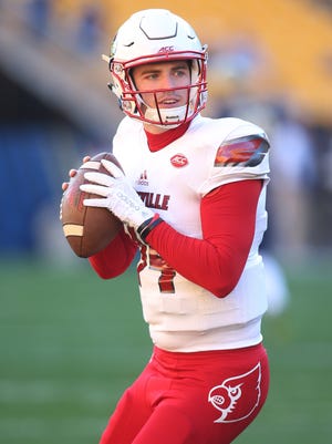 Nov 21, 2015; Pittsburgh, PA, USA; Louisville Cardinals quarterback Kyle Bolin (14) warms up before playing the Pittsburgh Panthers at Heinz Field. Mandatory Credit: Charles LeClaire-USA TODAY Sports