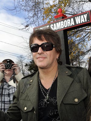 Richie Sambora talks to fans after Woodbridge residents and public officials gathered Tuesday, Nov. 24, 2009, in his hometown, Woodbridge, N.J., to name a street in his honor because of his philanthropy.