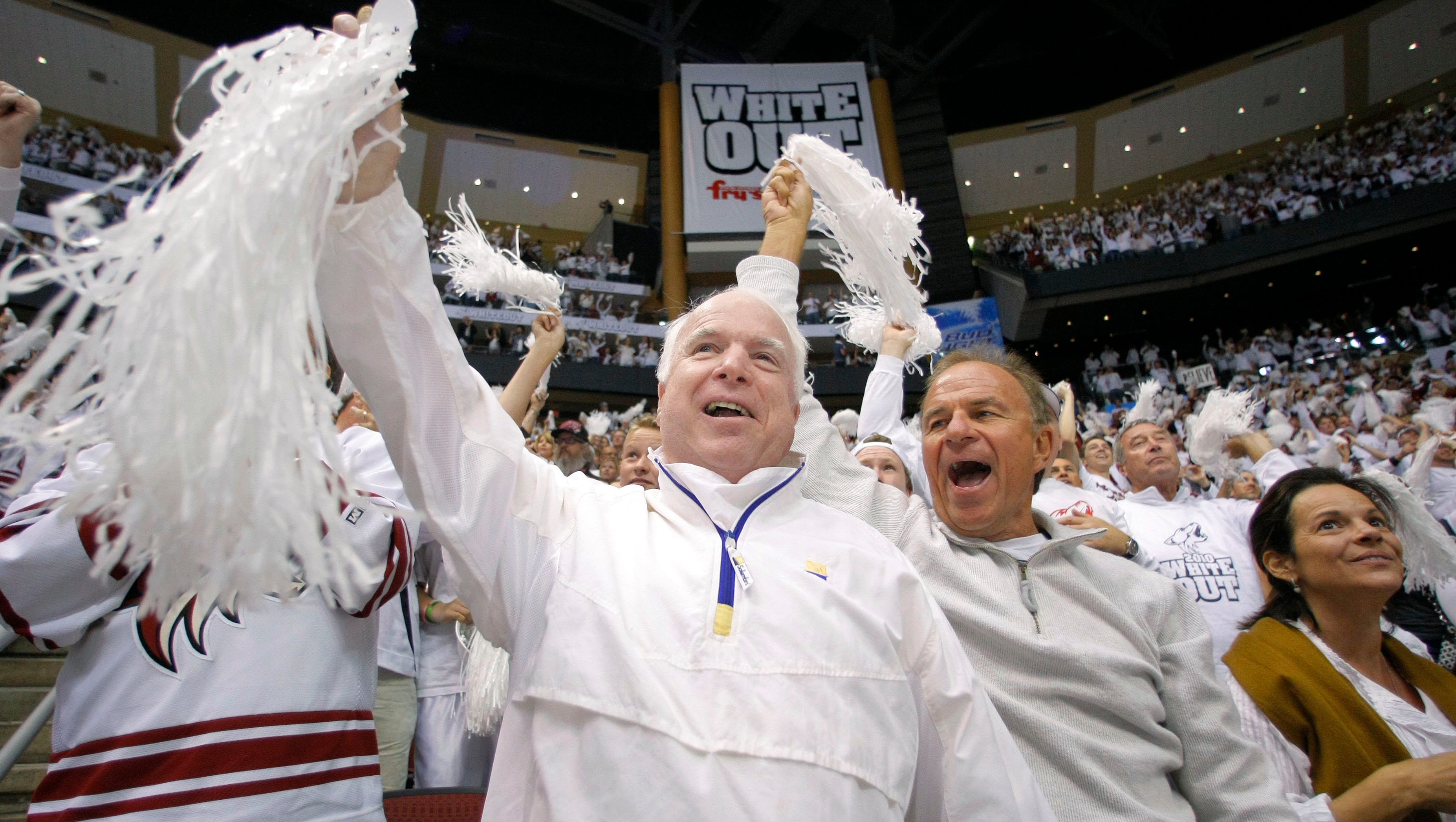 Sen. John McCain celebrates a goal by the Phoenix Coyotes