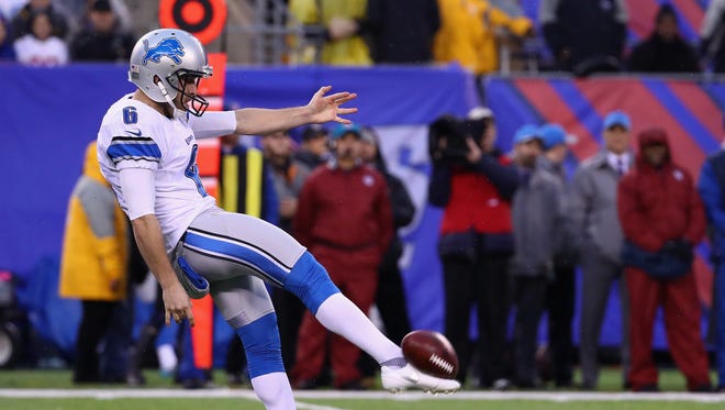 Lions punter Sam Martin punts the ball against the Giants in the first half at MetLife Stadium on Dec. 18, 2016 in East Rutherford, N.J.