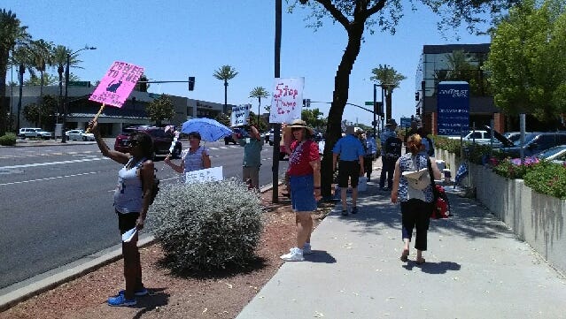 A group of Arizonans hold anti-American Health Care Act pickets June 23, 2017, near U.S. Sen. Jeff Flake's office.