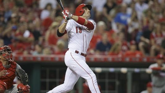 Cincinnati Reds' Joey Votto watches his third home run of the night, in the seventh inningagainst the Phillies, Tuesday, in Cincinnati. The Reds won 11-2.