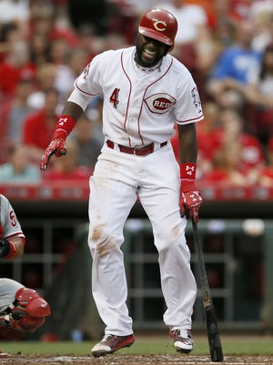 Reds second baseman Brandon Phillips winces after dodging an inside pitch during a June 9 game against the Phillies.