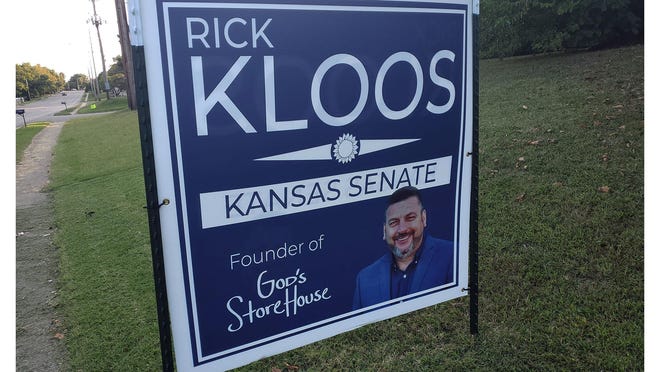 Signs for Rick Kloos, then a candidate for the Kansas Senate, noted his position as founder of God's Storehouse in Topeka.