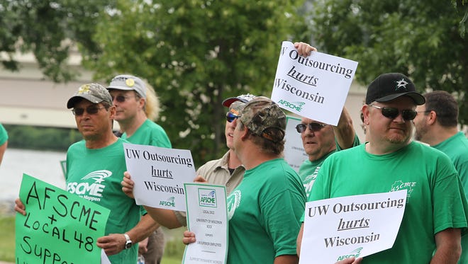 The American Federation of State, County and Municipal Employees (AFSCME) hold a rally at Carl Steiger Park  near the new University Alumni building in Oshkosh to show support to union workers in Superior where jobs are being threatened by outsourcing.