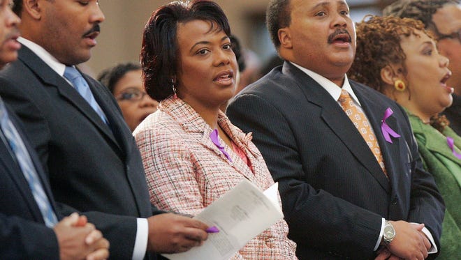 FILE - In this Feb. 6, 2006 file photo, the children of Martin Luther King Jr.,and Coretta Scott King, left to right, Dexter Scott King, Rev. Bernice King, Martin Luther King III and Yolanda King participate in a musical tribute to their mother at the new Ebenezer Baptist Church  in Atlanta Monday, Feb. 6, 2006.  A judge in Atlanta is set to hear motions Tuesday, Jan. 13, 2015, in the legal dispute that pits Martin Luther King Jr.’s two sons against his daughter Bernice in a dispute over two of his most cherished items. (AP Photo/John Bazemore, File)