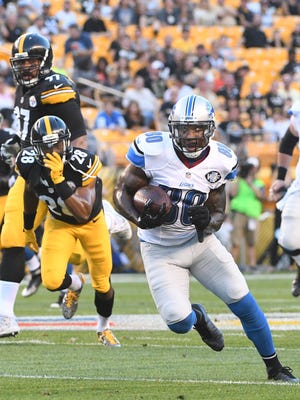 Lions wide receiver Anquan Boldin heads upfield after shaking off Steelers' Sean Davis after a reception for a 30-yard gain in the first quarter.