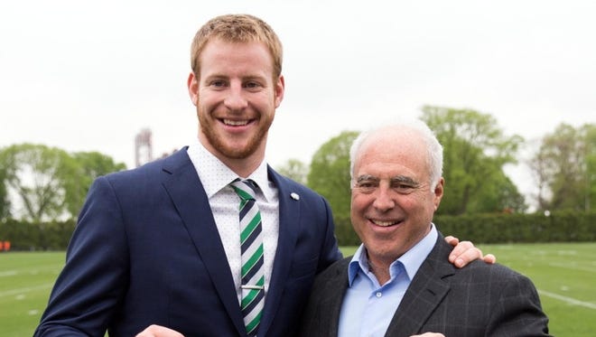 Eagles owner Jeffrey Lurie, right, poses with quarterback Carson Wentz after the Eagles made him the second overall pick in the 2016 draft via trade with the Cleveland Browns.