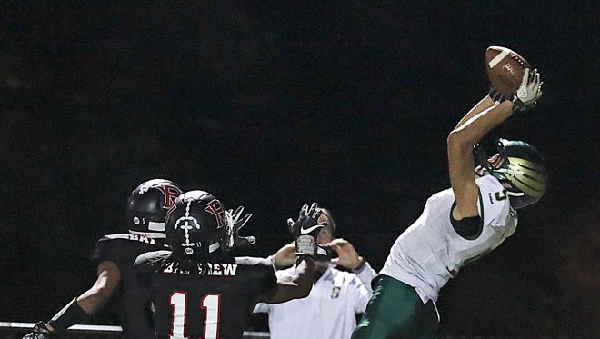 Greenfield's Elijah Rosario makes a sensational leaping catch.