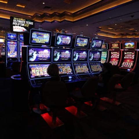 Patrons play video slot machines at Empire City Ca